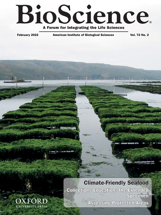 A image showing the cover of the journal BioScience from the Feb 2022 issue. The photo on the front shows racks of cultured seaweed drying and the text reads: Climate Friendly Seafood  